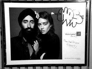 Anti-Muslim graffiti was found scribbled on a GAP ad featuring the Sikh jewelry designer and actor Waris Ahluwalia on a New York City subway platform. [Robert Gerhardt]


