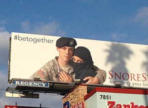 Billboard featuring U.S soldier and a Muslim woman displayed along Sunset Boulevard in Los Angeles. [Alarabyah.net]