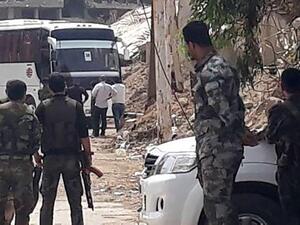 حافلات تقل المسلحين وعائلاتهم تستعد لمغادرة بلدات جنوب دمشق