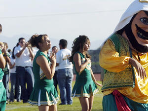 Coachella Valley High School’s mascot dances to the band during a pep rally at the school in Thermal, Calif. [Associated Press]