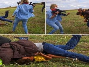 لحظة عرقلة اللاجىء السوري وطفله من قبل المصورة التلفزيونية المجرية