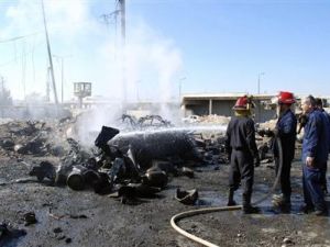 Fire-fighters extinguish a vehicle on fire after a suicide bomber in a truck carried out an attack at the eastern entrance of Hama city ,October 20, 2013. [Reuters/SANA/Handout]