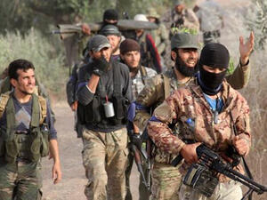 Rebels move through Idlib. (AFP/Omar Haj Kadour)