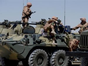 Russian army soldiers are seen with their vehicles at their military camp, known as the International Demining Center, in the ancient Syrian city of Palmyra . (AFP/ File Photo)