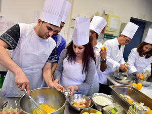 Syrian refugees in Germany prepare Iftar together (AFP)