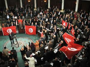 Critics of the new law voiced concerns over putting customized conditions that fit specific parties who may exploit the country's difficult economic situation. (AFP/File)