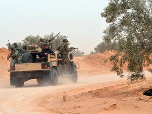 Tunisian military forces patrol back streets near Ben Guerdan. (AFP/Fathi Nasri)