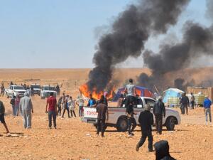 Smoke belows during clashes between Tunisian protesters and security forces outside the El Kamour oil and gas pumping station, in the southern state of Tataouine, on May 22, 2017, as locals stage a sit-in to demand a share of local resources and priority for jobs in the sector. (AFP/Fathi Nasri)