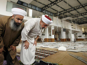  Sidon's mufti Sheikh Salim Sousan (R) prays inside the Bilal bin Rabah mosque, in the Abra district of the southern city of Sidon on June 29, 2013 (Source: AFP/MAHMOUD ZAYYAT)