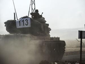 A Turkish army tank enters Syria last week (AFP/Bulent Kilic)