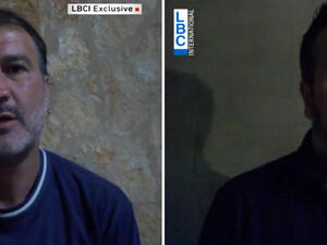 Turkish Airlines pilots Murat Akpinar (L) and Murat Agca, who were kidnapped in Beirut in August 2013. [AFP]