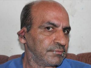  اللاجئ غلام رضا شيردام، البالغ من العمر 48 عاما