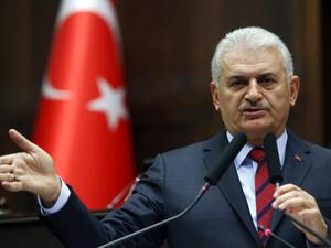 Turkish Prime Minister and leader of Turkey's ruling Justice and Development Party (AKP) Binali Yildirim addresses the AKP group meeting at the Grand National Assembly of Turkey in Ankara on November 29, 2016. (AFP/Adem Altan)