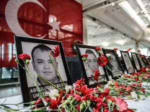 Flowers left by airport employees next to photos of victims killed during the triple suicide bombing and gun attack at Istanbul's Ataturk airport. (AFP/Ozan Kose) Flowers left by airport employees next to photos of victims killed during the triple suicide bombing and gun attack at Istanbul's Ataturk airport. (AFP/Ozan Kose)