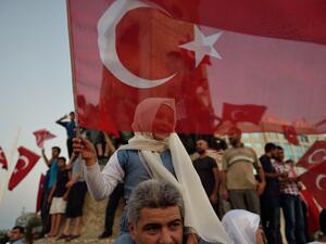 A child waves a Turkish flag in Istanbul on July 16, 2016 during a demonstration in support to Turkish president. (AFP/Daniel Mihailescieu A child waves a Turkish flag in Istanbul on July 16, 2016 during a demonstration in support to Turkish president. (AFP/Daniel Mihailescieu
