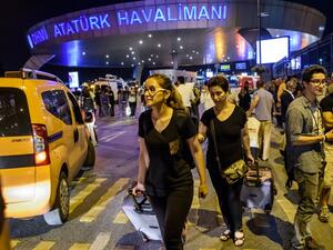Passengers leave Ataturk airport in Istanbul on June 28, 2016 after two explosions followed by gunfire hit Turkey's biggest airport, killing at least 28 people and injuring 20. (AFP/Ozan Kose) Passengers leave Ataturk airport in Istanbul on June 28, 2016 after two explosions followed by gunfire hit Turkey's biggest airport, killing at least 28 people and injuring 20. (AFP/Ozan Kose)