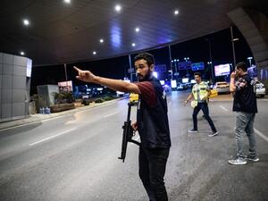 A Turkish police officer reacts at Ataturk airport`s main gate on June 28, 2016 in Istanbul after two explosions followed by gunfire hit Turkey's biggest airport. (AFP/Ozan Kose) A Turkish police officer reacts at Ataturk airport`s main gate on June 28, 2016 in Istanbul after two explosions followed by gunfire hit Turkey's biggest airport. (AFP/Ozan Kose)