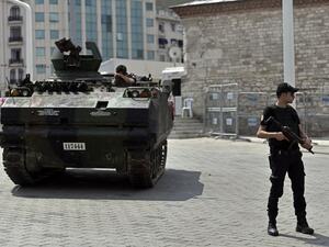 A police officer stands next to an armored vehicle that was used by soldiers during the coup attempt at Taksim square in Istanbul on July 17, 2016. (AFP/Aris Messinis) A police officer stands next to an armored vehicle that was used by soldiers during the coup attempt at Taksim square in Istanbul on July 17, 2016. (AFP/Aris Messinis)
