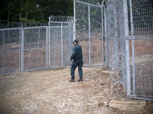 A Bulgarian border police officer stands near a new barbed wire fence at the border between Bulgaria and Turkey near the town of Malko Tarnovo on May 22, 2016. (AFP/Nikolay Doychinov) A Bulgarian border police officer stands near a new barbed wire fence at the border between Bulgaria and Turkey near the town of Malko Tarnovo on May 22, 2016. (AFP/Nikolay Doychinov)
