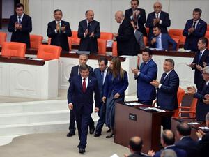 People applaud as Turkey's outgoing Prime Minister Ahmet Davutoglu (C) walks on May 17, 2016 during the discussions on the ruling AK Party's proposal regarding the amendment of the immunity at the Turkish Parliament in Ankara. (AFP/Adem Altan) People applaud as Turkey's outgoing Prime Minister Ahmet Davutoglu (C) walks on May 17, 2016 during the discussions on the ruling AK Party's proposal regarding the amendment of the immunity at the Turkish Parliament in Ankara. (AFP/Adem Altan)