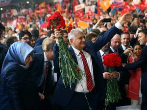 Turkey's Minister of Transport, Maritime and Communication and new chairman candidate for ruling AK Party Binali Yildirim greets supporters as he arrives with his wife Semiha Yildirim for the second extraordinary congress of the AK Party in Ankara, on May 22, 2016. (AFP/Adem Altan) Turkey's Minister of Transport, Maritime and Communication and new chairman candidate for ruling AK Party Binali Yildirim greets supporters as he arrives with his wife Semiha Yildirim for the second extraordinary congress of the AK Party in Ankara, on May 22, 2016. (AFP/Adem Altan)