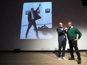 Winner of the World Press Photo 2016 photographer Burhan Ozbilici (R) speaks next to Lars Boering, managing director of the World Press Photo Foundation (L) during the announcement of the World Press Photo prizes in Amsterdam, on February 13, 2017. (AFP/Jeroen Jumelet)