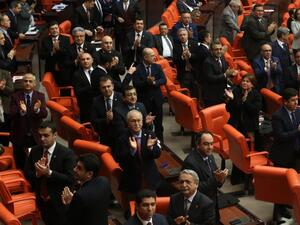 Legislators of the main opposition Republican People's Party (CHP), applaud in protest during the second tour debating a reform of the constitution, at the Turkish parliament in Ankara on January 18, 2017. (AFP/Adem Altan)