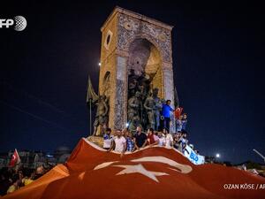 Protesters waive a Turkish flag in Istanbul during Friday's coup attempt (AFP/Ozan Kose)