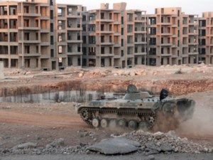 Opposition fighters drive tank in eastern government-besieged neighbourhood of Aleppo. (AFP/File)