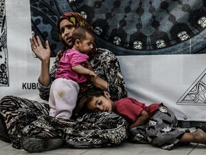 Woman begging in the street. (AFP)