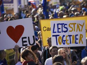 Demonstrators take part in the People's Vote march calling for a referendum on a final Brexit deal in central London on Oct. 20. (AFP) 
