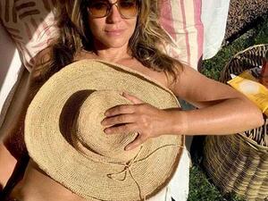 Elizabeth Hurley, 53, went topless for a sizzling snap which saw her cover her assets with an oversized fedora fat as she basked in the scorching weather. (Instagram/ Elizabeth Hurley)