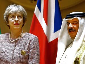King of Bahrain Hamad bin Issa al-Khalifa pose with British Prime Minister Theresa May in Manama, Bahrain in December 2016. (AFP/File)