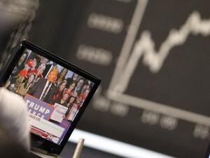 On the currency markets, the dollar tumbled about 2 per cent against major global currencies as Trump supporters celebrated his victory over Democrat candidate Hillary Clinton. (AFP/Daniel Rowland)