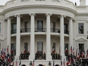 French President Emmanuel Macron (2nd R), US President Donald Trump (R), First Lady Melania Trump (2nd L) and Brigitte Macron listen to the national anthems during a state welcome at the White House in Washington, DC, on April 24, 2018. Ludovic MARIN / AFP