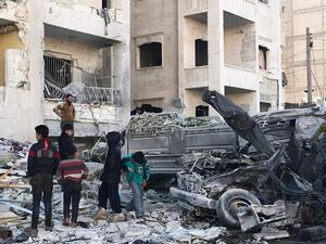 People look at the damage in the aftermath of an explosion in a rebel-held area of the northwestern Syrian city of Idlib on January 8, 2018. (AFP/File)