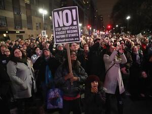 People gather outside the Trump International Hotel in Manhattan to protest against Donald Trump on January 19, 2017 in New York City. Trump will be inaugurated January 20th as the 45th President of the United States. (AFP/John Moore)
