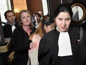 One of the victims (2ndR) arrives to attend the so-called "Conrad princesses" trial in front of the Brussels criminal court for human trafficking, on May 11, 2017. (AFP/Dirk Waem)