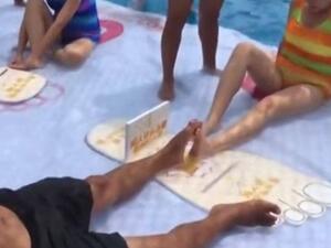 The bizarre match involves two opponents locking their feet and attempting to ping each other's foot down (Screenshot)