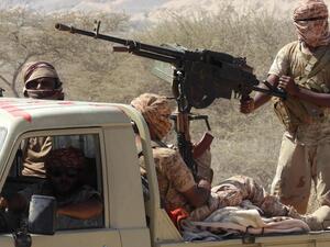 Yemeni fighters loyal to the government ride in the back of a pickup truck while closing in on a suspected location of an Al Qaeda in the Arabian Peninsula (AQAP) leader in February. Saleh Al Obeidi / AFP