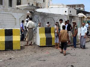 People gather at the site of a car bombing near the Foreign Ministry in Aden on Friday. (AFP/Saleh Al-Obeidi) People gather at the site of a car bombing near the Foreign Ministry in Aden on Friday. (AFP/Saleh Al-Obeidi)