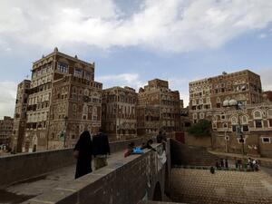 Residents walk toward the old city of Yemen's capital, Sanaa. (AFP/Mohammed Huwais) Residents walk toward the old city of Yemen's capital, Sanaa. (AFP/Mohammed Huwais)