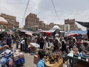 Yemenis shop at a market in the capital Sanaa on August 30, 2017, as Muslims prepare to celebrate the annual holiday of Eid al-Adha (Mohammed Huwais/AFP)