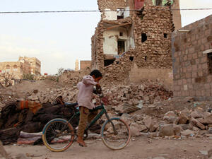 Buildings hit by Saudi air strikes in old neighbourhood of Sanaa in March (AFP)