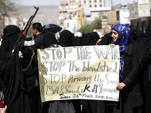 Yemeni women hold placards at a protest outside the Saudi embassy in Sanaa, Yemen, on March 18, 2017. (AFP/Mohammed Huwais)