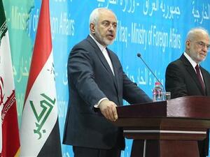 Iranian Foreign Minister Mohammad Javad Zarif (L) speaks during a press conference with Iraqi Foreign Minister Ibrahim al-Jaafari in the Iraqi capital Baghdad on February 24, 2015. (AFP)