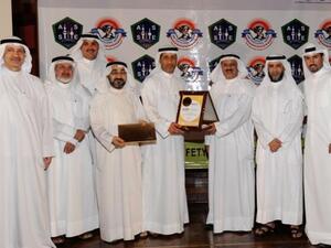 Company executives holding the award