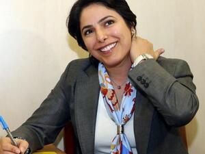 Kuwaiti candidate Reham al-Jlewe registers for the upcoming parliamentary election in Kuwait City (AFP)