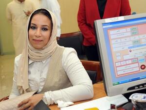 Kuwaiti candidate Haya al-Mutairi registers in the last day for the upcoming parliamentary election in Kuwait City on July 6 (AFP)
