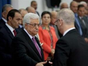 الرئيس الفلسطيني محمود عباس ورئيس الوزراء رامي الحمد الله